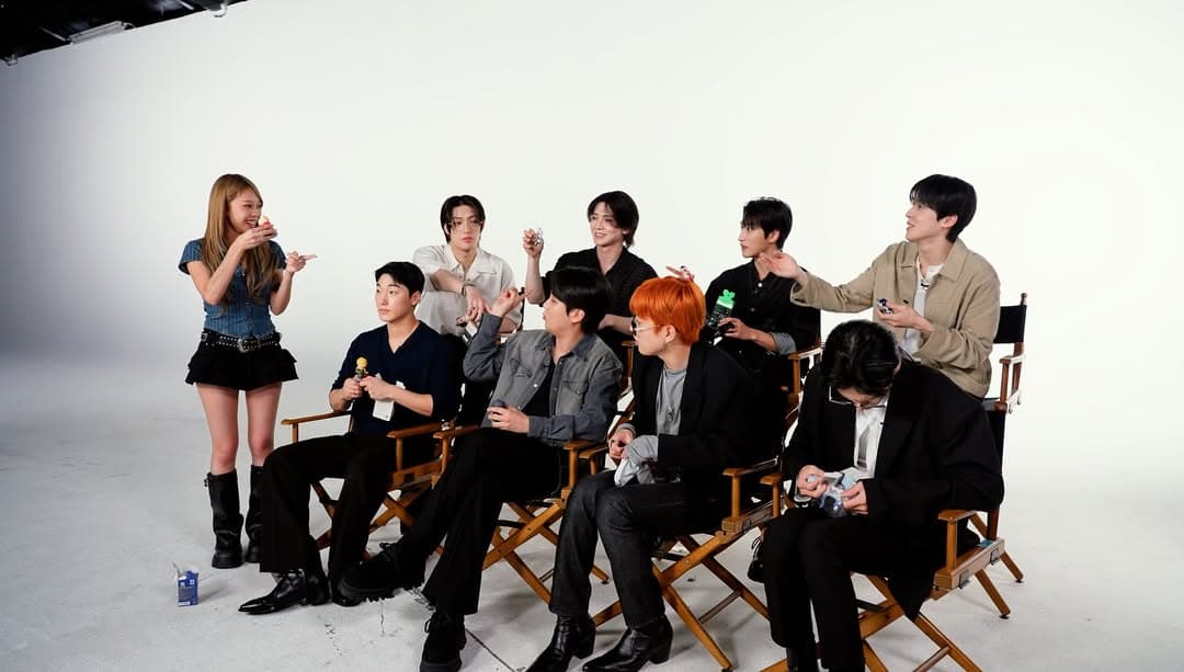 Sunny filming a studio segment with ATEEZ for a vlog on the main channel.